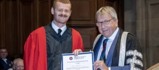 Principal Peter Mathieson presenting Euan Stamper The Sir William Darling Memorial Prize 2024