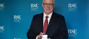 Rob Dunbar holding the Sir Walter Scott medal