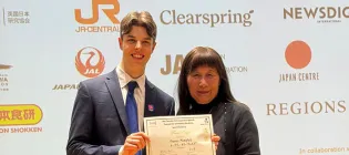 Photo of a student on the left and his mentor at the Japanese Speech Contest