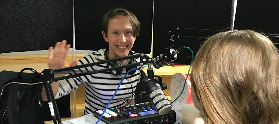 Photo of podcast host in studio