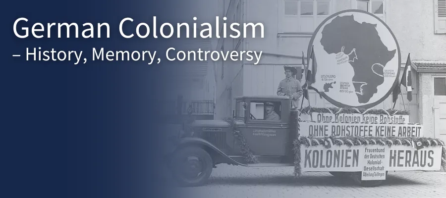 A van with a cardboard globe on the back driving down a street with the event title overlaid