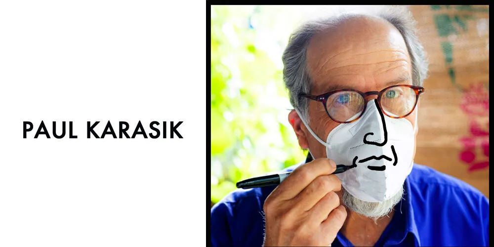 Image of Paul Karasik in a white medical face mask, drawing a nose and mouth on top of the mask
