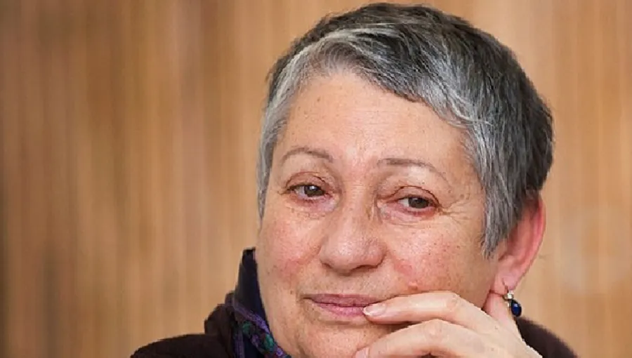 a portrait of Ludmila Ulitskaya staring pensively into middle distance