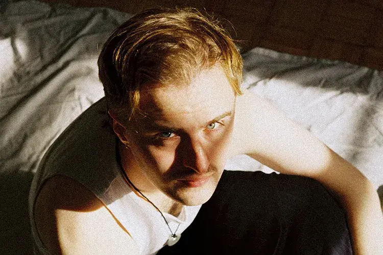 Hector looking at the camera from below. Only his head and shoulders are visible.