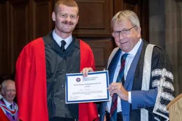 Euan Stamper presented with the Sir William Darling Memorial Prize 2024 by Principal Peter Mathieson