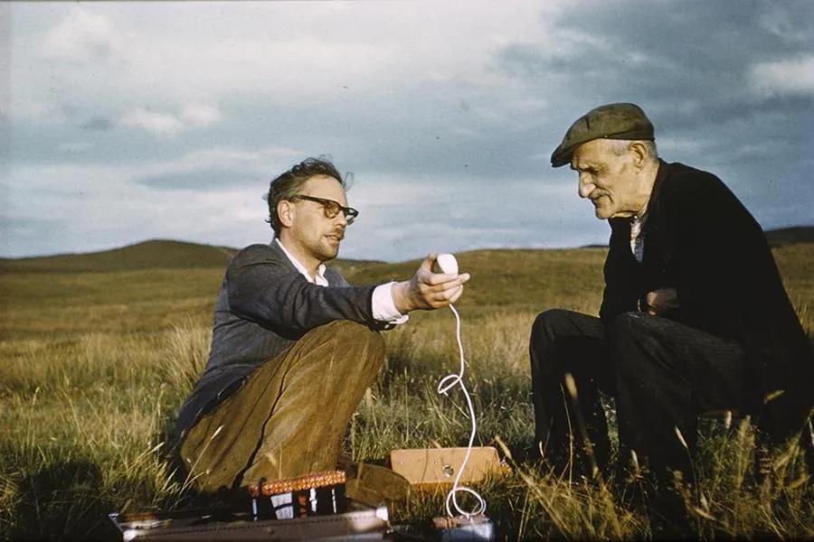 Photo of two men with a microphone