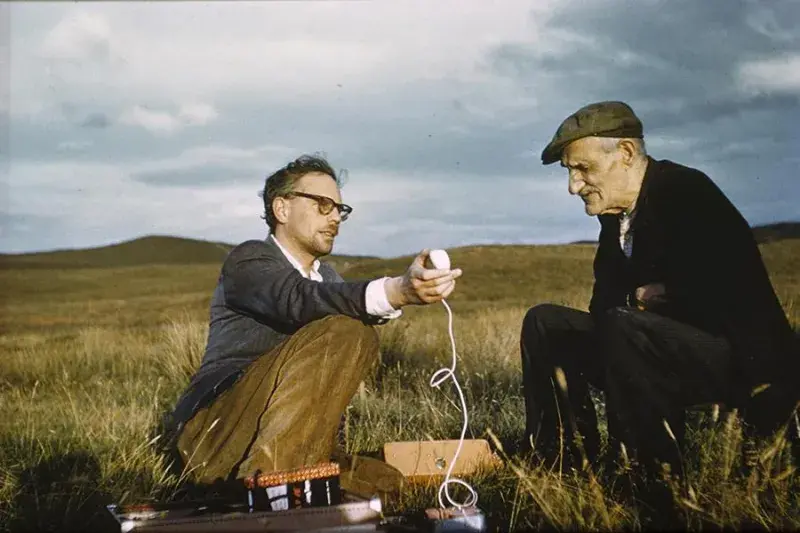 Photo of two men with a microphone