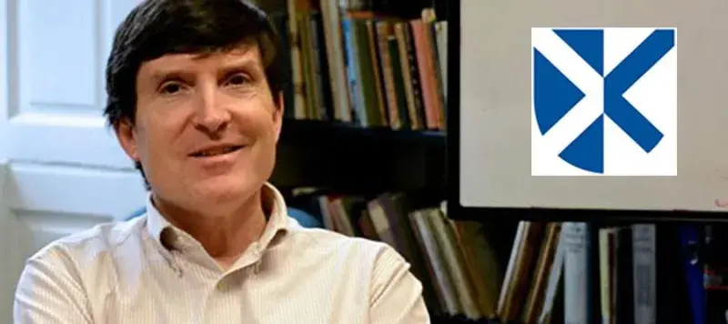 Photo of Wilson McLeod in his office