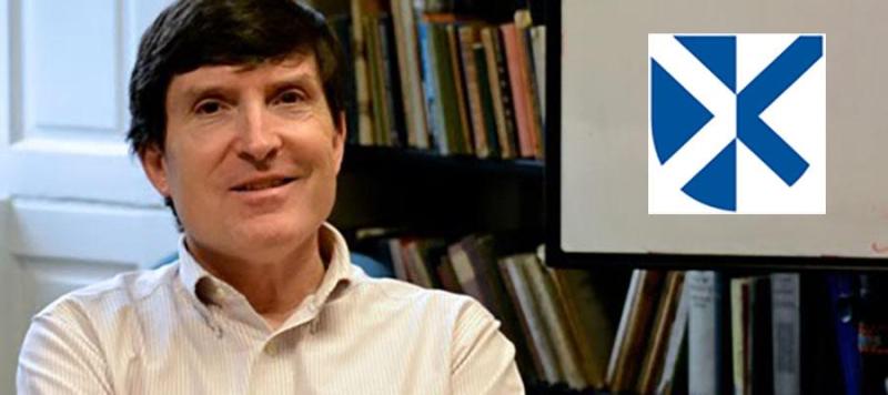 Photo of Wilson McLeod in his office