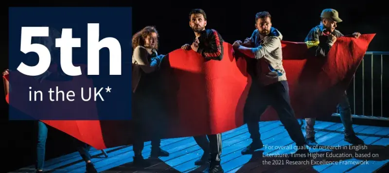 Text reading 5th in the UK in top left corner. Four people on a stage, standing in a line holding a red sheet
