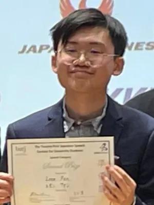 Photo of a student holding a certificate