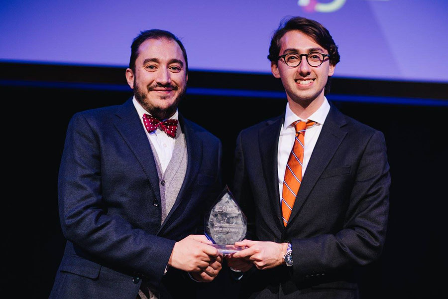 Carlos Soler Montes with a student and his teaching award