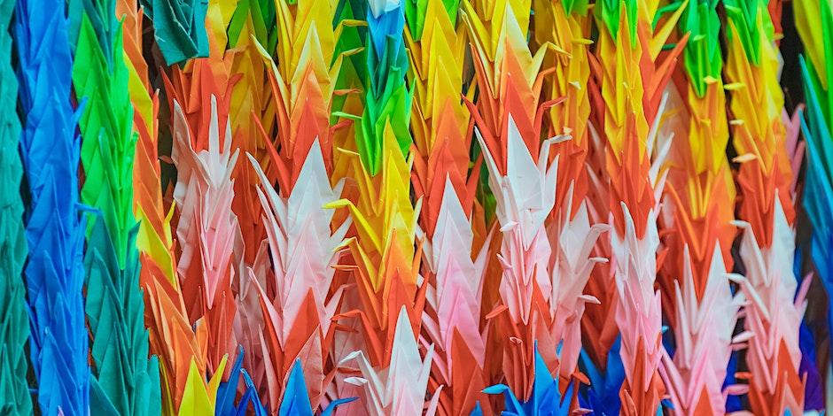 a series of colourful paper cranes