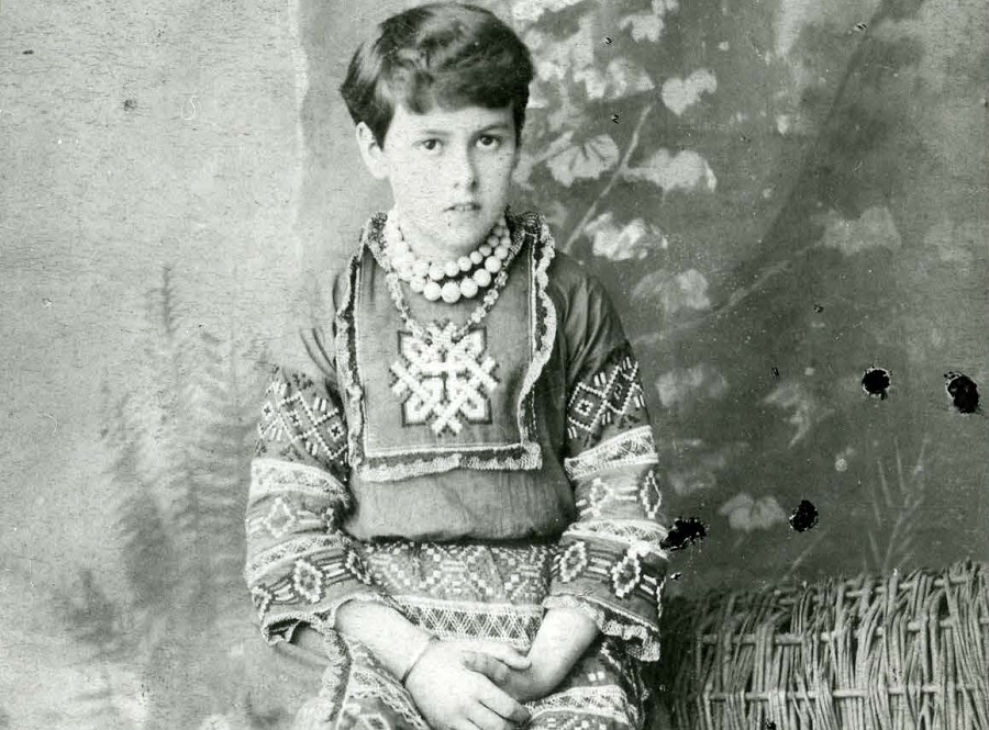 a black and white photo of a young boy dressed as a Ukrainian peasant