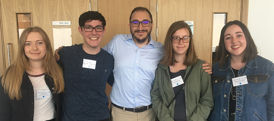 Photo of four language students and their tutor