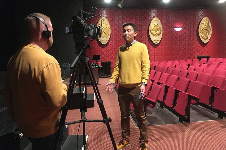 Photo of Shuangyi Li being interviewed