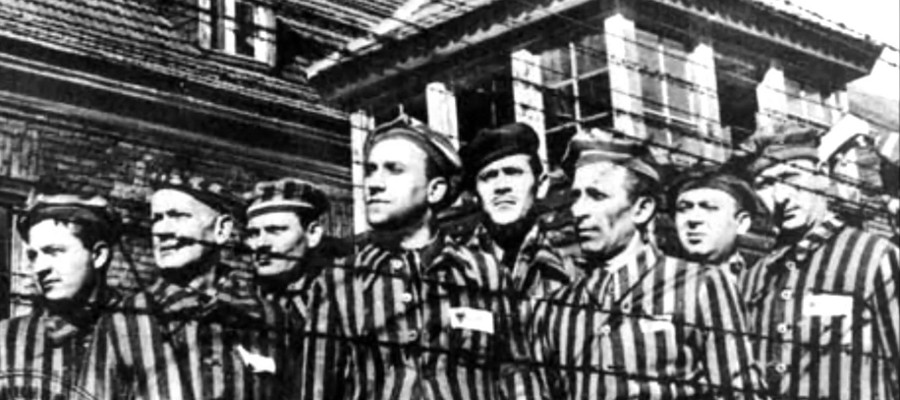 a black and white photo of prisoners at a camp during WWII